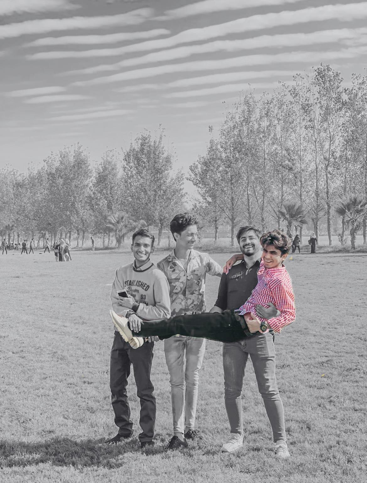 Uzair with friends in early university years
